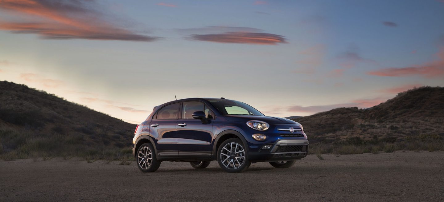 A couple in the front seat of the 2020 Fiat 500X presented from the rear seat.